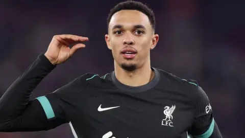 Alexander-Arnold does a 'talk' gesture as he celebrates scoring Liverpool's fourth goal against West Ham United at London Stadium last week