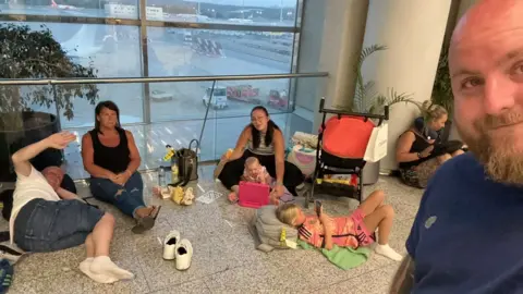 Jack Bowman/X Jack Bowman and his family are waiting to fly out of Palma