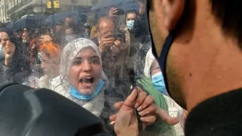 Algerian women chant slogans during an anti-government protest in the capital Algiers on March 8, 2021.