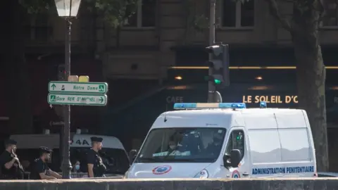 Reuters French police officers secure a convoy believed to be transporting suspects