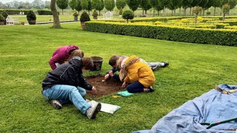 Small Pits, Big Ideas Children joining archaeological dig