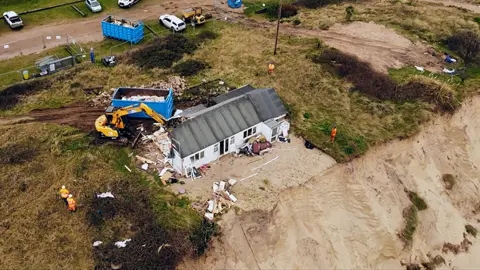 Shaun Whitmore/BBC Aerial few of the final property on The Marrams, the north side of Hemsby Gap, being demolished