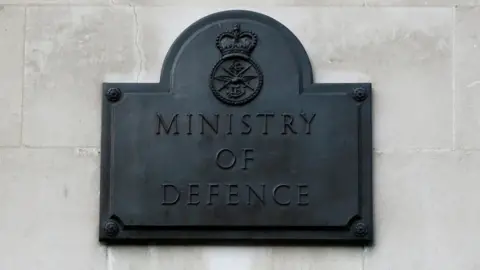 Reuters A sign hangs outside the Ministry of Defence building in London