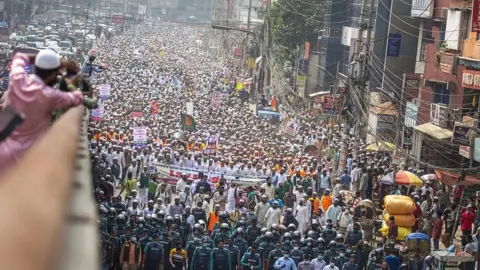 EPA Protest calling for the boycott of French products and to denounce French President Emmanuel Macron in Dhaka, Bangladesh, October 27, 2020