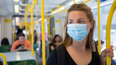 Getty Images person on public transport wearing mask
