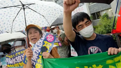 EPA Protesters call for the water release plan to be called off in a rally outside the Japanese PM's residence in Tokyo