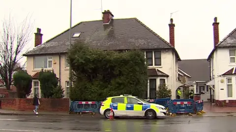 police car outside house