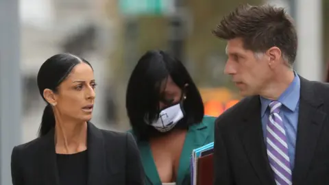 Reuters R Kelly's defence attorney Nicole Blank Becker and Thomas Farinella arrive at the court