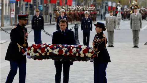 Reuters France's President Emmanuel Macron lays a wreath at the Tomb of the Unknown Soldier at the Arc de Triomphe