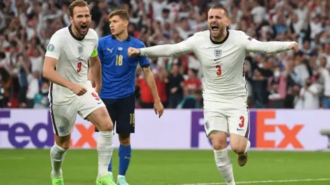 Reuters England's Luke Shaw celebrates scoring with Harry Kane