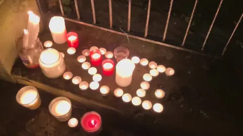 Candles lit to pay tribute to Simon Lingard