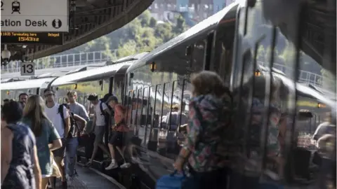 Getty Images Train passengers