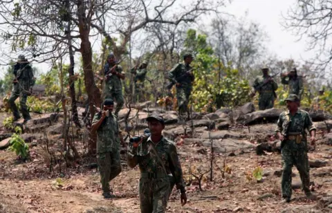 Getty Images Indian security forces comb the forest in Sonbhadra district of southern Uttar Pradesh, for naxalites.