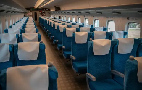 Carl Court/Getty Images A shinkansen bullet train carriage is almost completely empty on April 22, 2020 in Yokohama, Japan
