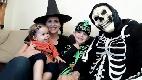 Elizabeth Lusty Elizabeth Lusty in Halloween fancy dress with her family