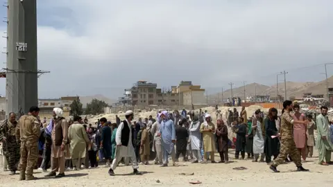 EPA Afghans at Kabul airport