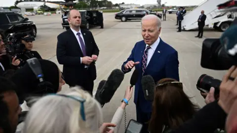 Getty Images Joe Biden with reporters