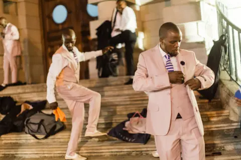 Rajesh Jantilal/AFP Members of a traditional isicathamiya group outside the Natal Playhouse Theatre in Durban, South Africa - Friday 23 September 2023