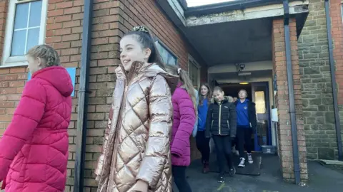 Children outside on one of their hourly breaks