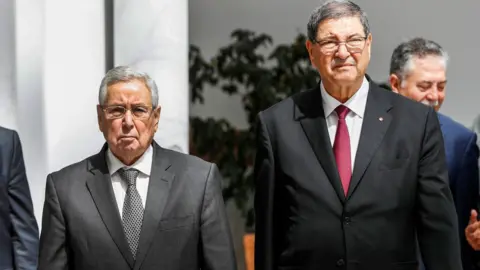AFP Mr Bensalah (l) during his recent visit to Tunisia for the Arab Summit