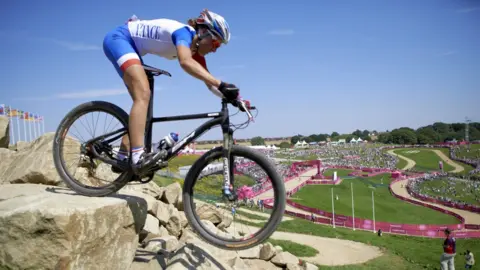 Getty Images Mountain Biking: 2012 Summer Olympics: France Julie Bresset in action during Women's Cross-Country Final at Hadleigh Farm in Essex County. Bresset wins gold. Castle Point, United Kingdom 8/11/2012