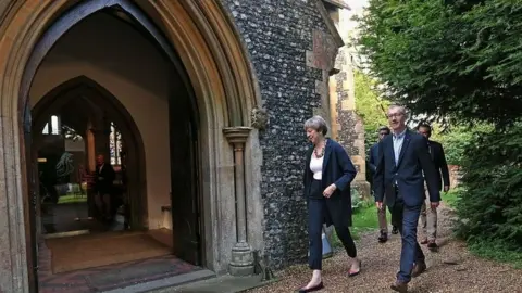 PA Theresa May and her husband Philip attending a church service in her constituency