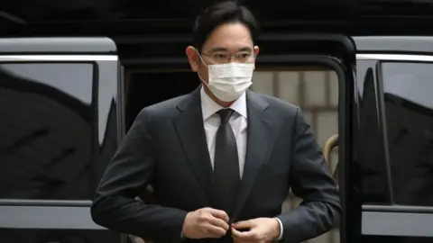 Getty Images JY Lee stepping out of a car