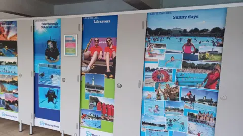Vivacity A swimming pool's cubicle doors, each one covered with a montage of brightly coloured photographs taken at the lido over 90 years. They show men, women and children swimming, lifeguards and as sub aqua club, swimming underwater.