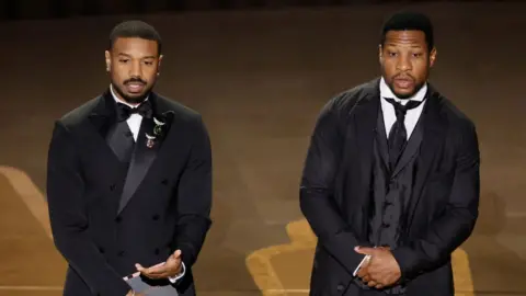 Getty Images Michael B Jordan and Jonathan Majors at the Oscars presenting an award