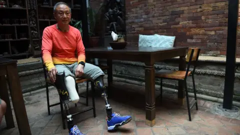 AFP Chinese double amputee climber Xia Boyu, pictured in an interview in 2014