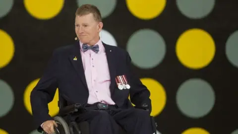 Getty Images Retired Captain Trevor Greene of the Canadian Armed Forces speaks during the opening ceremony