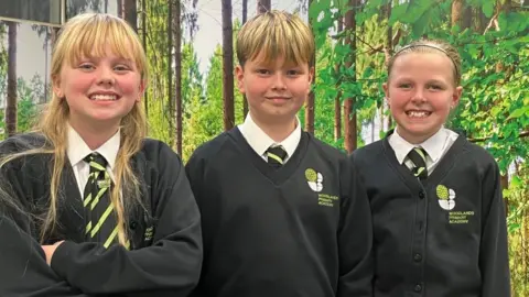 ANDREW TURNER/BBC Woodlands Primary School children Tallulah, Fletcher and Milly, all aged 10.