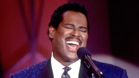 Getty Images Luther Vandross on the Oprah Winfrey show in 1984, wearing a blue jacket