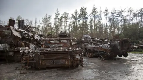 Getty Images Destroyed armoured vehicles abandoned in muddy ground