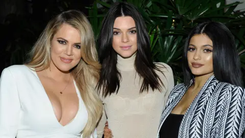 Getty Images Khloe Kardashian, Kendall Jenner and Kylie Jenner