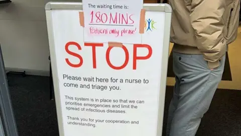 Ewan Chamberlain Poster asking patients to be patient