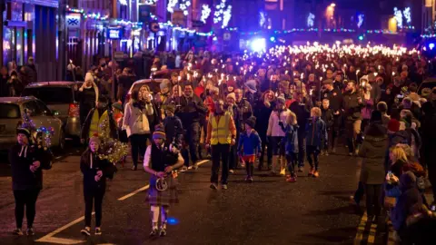 Ian Linton People with torches