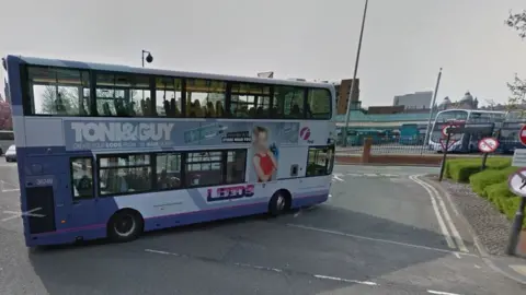 Google First Leeds bus going into bus station