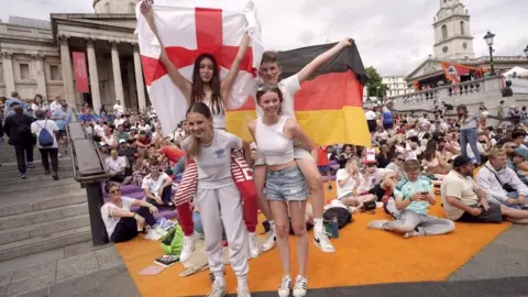 PA Media Fans gather in Trafalgar Square