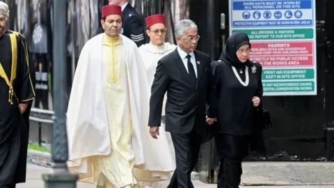 Samir Hussein His Majesty Yang di-Pertuan Agong Al-Sultan Abdullah Ri'ayatuddin Al-Mustafa Billah Shah of Malaysia and Her Majesty Raja Permaisuri Agong Tunku Hajah Azizah Aminah Maimunah Iskandariah of Malaysia at Westminster Abbey