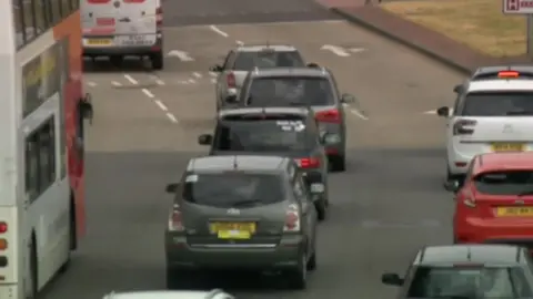 Private hire cabs travelling in convoy on a Wolverhampton road on Monday