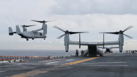 Reuters U.S. Marine MV-22B Osprey aircraft land on the deck of the USS Bonhomme Richard amphibious assault ship off Sydney