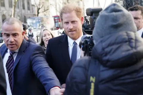 Jordan Pettitt / PA Media The Duke of Sussex (centre) arrives at the Royal Courts Of Justice in London