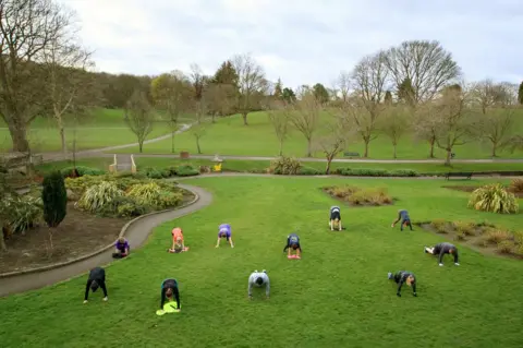 PA Media People exercise in a group class in a park