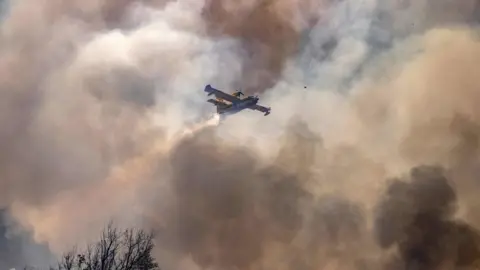 AFP Aircraft flying through plumes of smoke