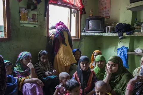 Mansi Thapliyal House in Khajuri Khas filled with women and children sat on the floor