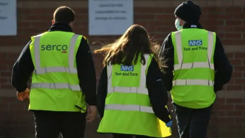 Getty Images Serco and NHS workers