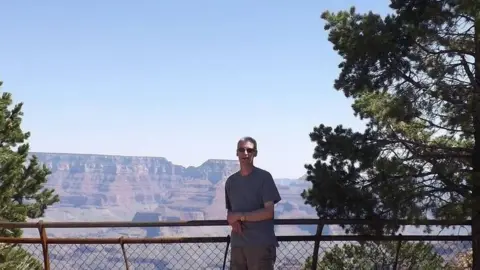 AS Police Portrait of Jason lock in front of a mountain