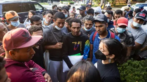 EPA-EFE/REX/Shutterstock Migrants in Washington DC