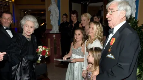 Getty Images The Queen with comedian Fran Carson (right)